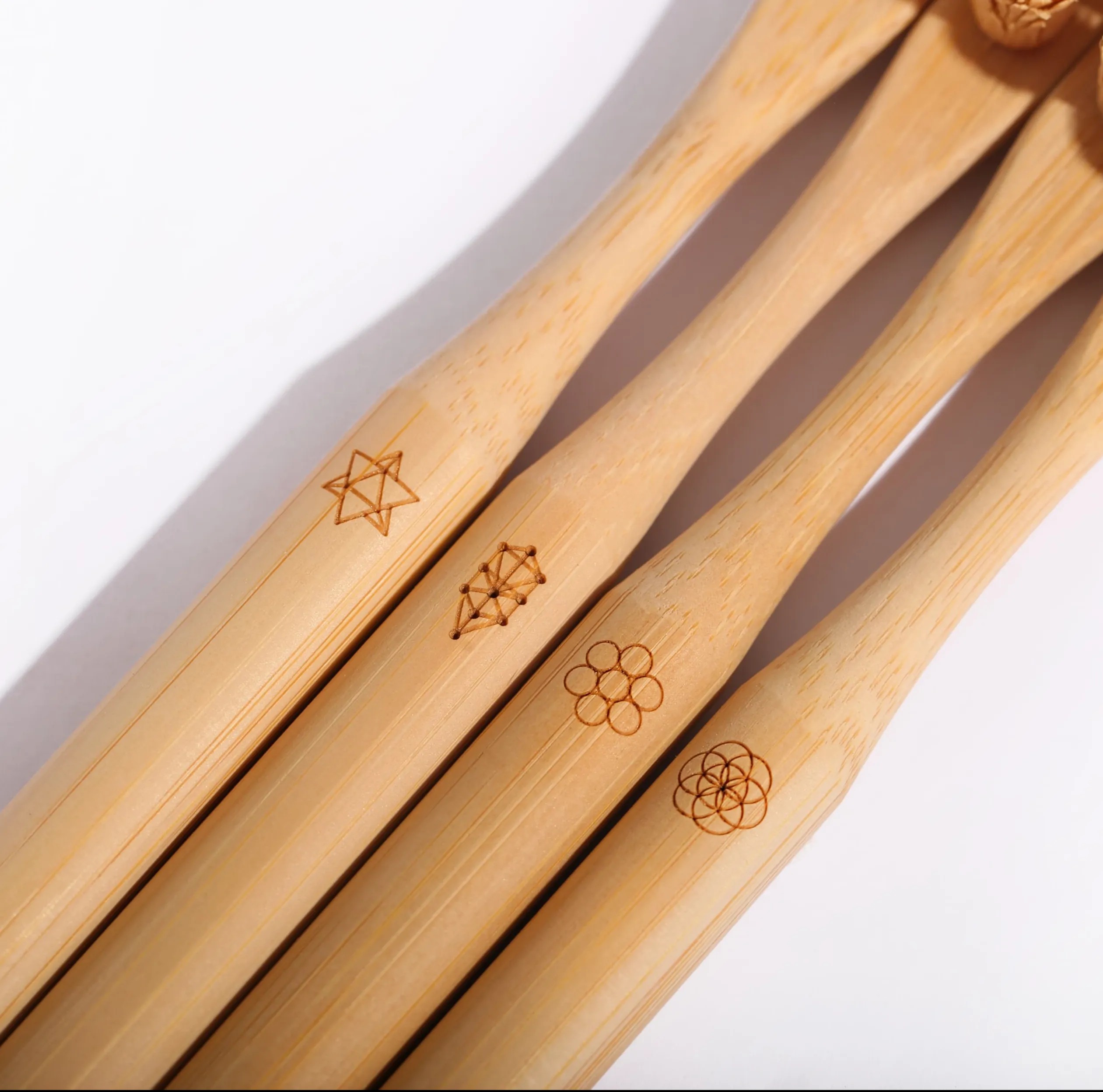 Bamboo toothbrush handles laser engraved custom logos – Naoplas OEM personalization